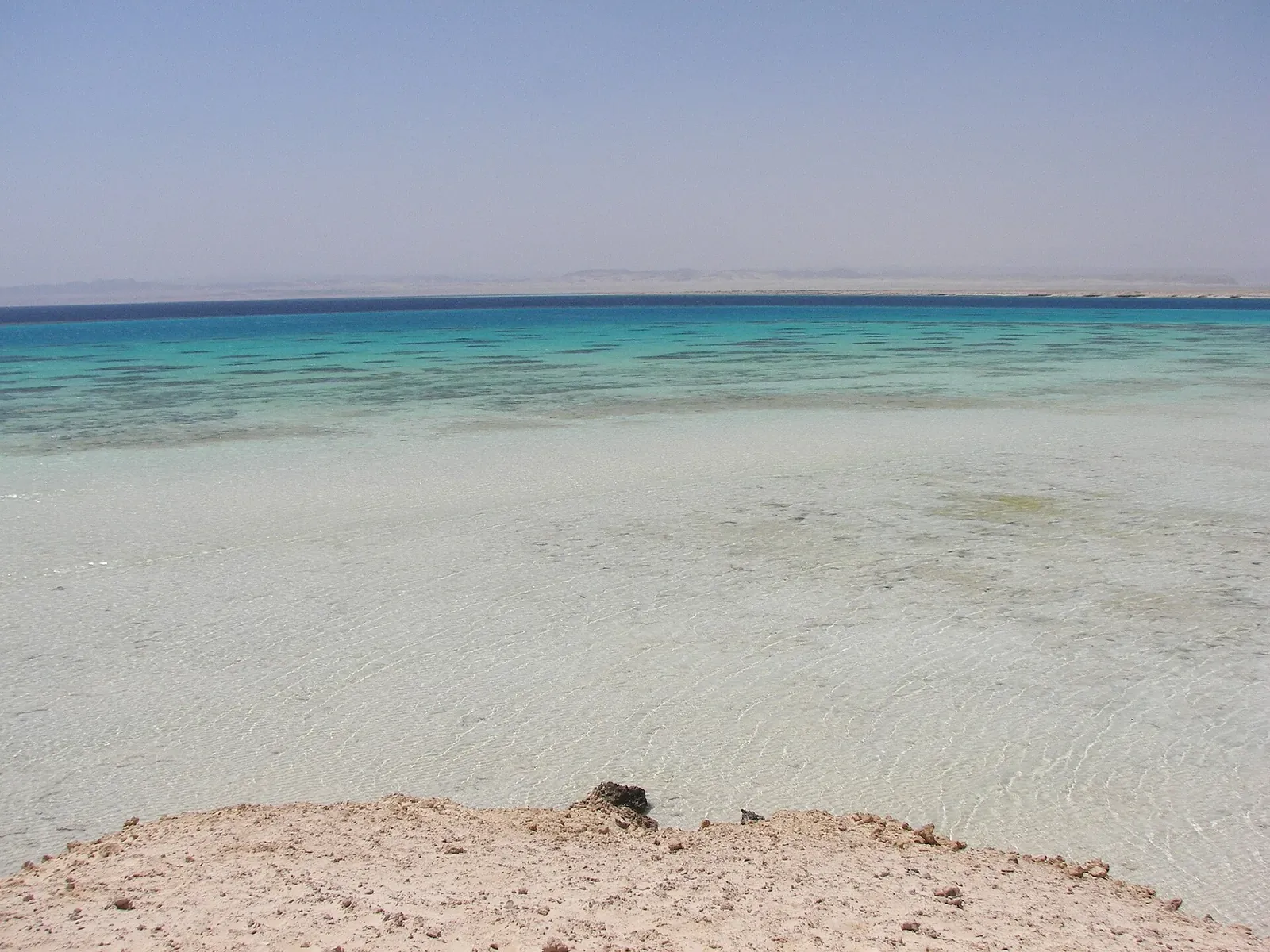 Shallow turquoise water and open coast at Sharm El Loli near Marsa Alam