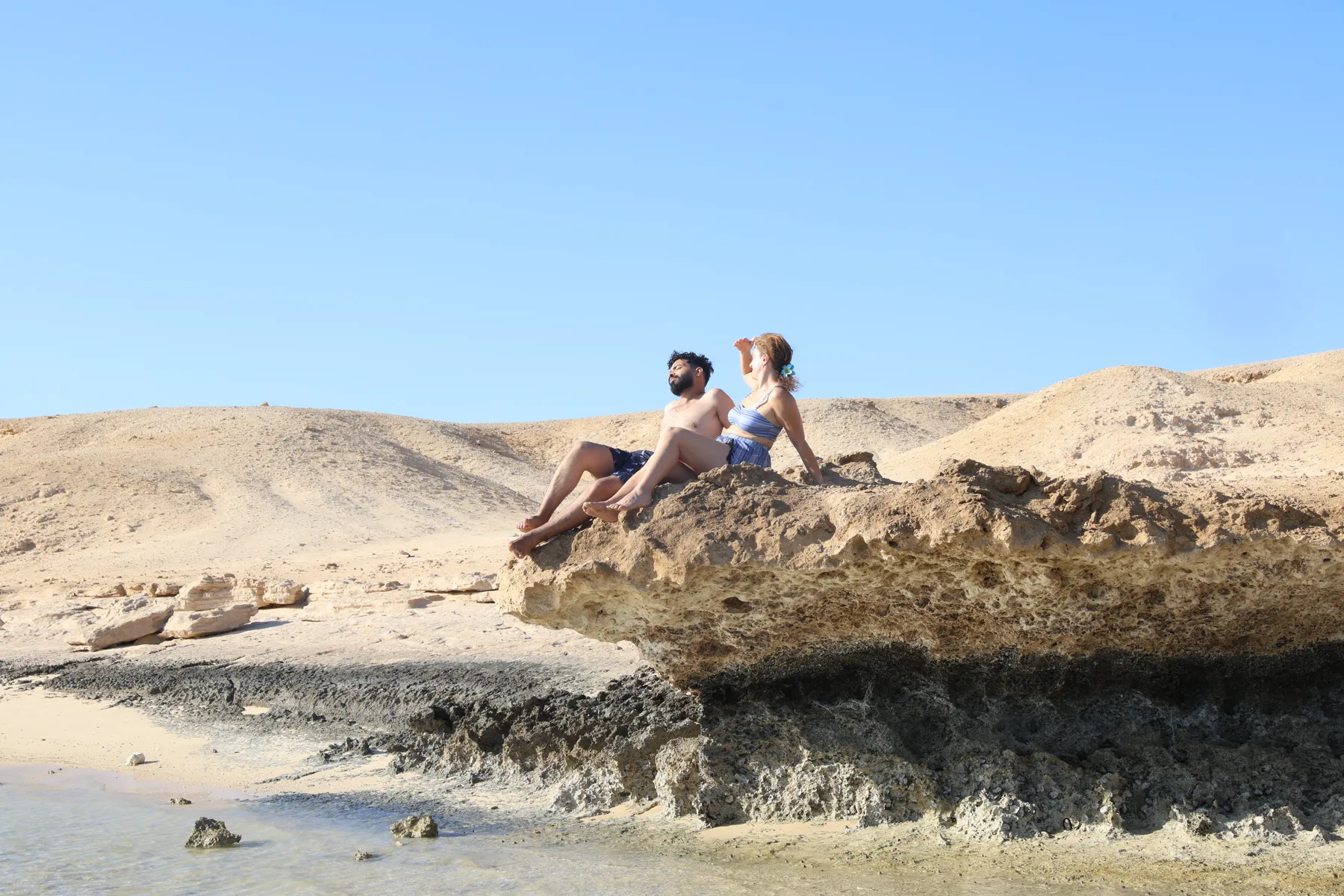 Guests resting on a Red Sea island during a MARO speedboat trip